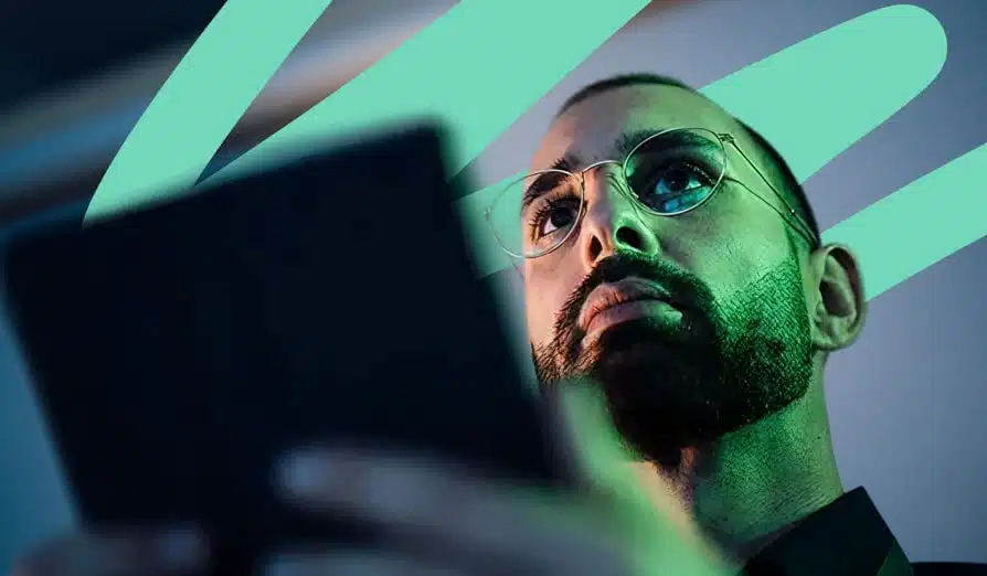 Male employee holding a tablet and working