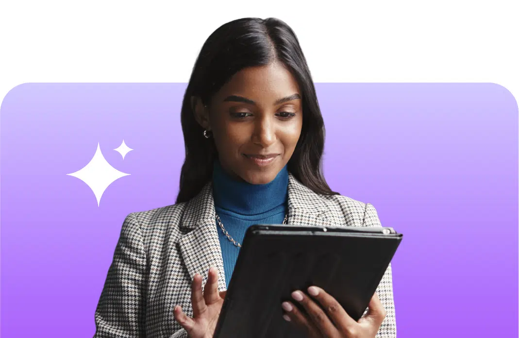 Female employee smiling and looking at her tablet