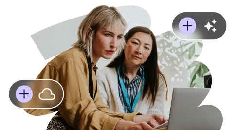 Coworkers exploring ideas using AI assistance on their laptop