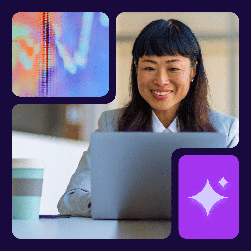 Female employee wearing business clothes smiling and working on her laptop